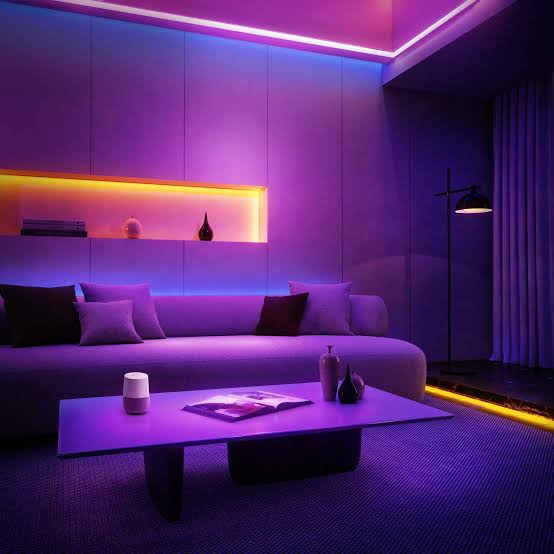 Modern living room with purple lighting and decor